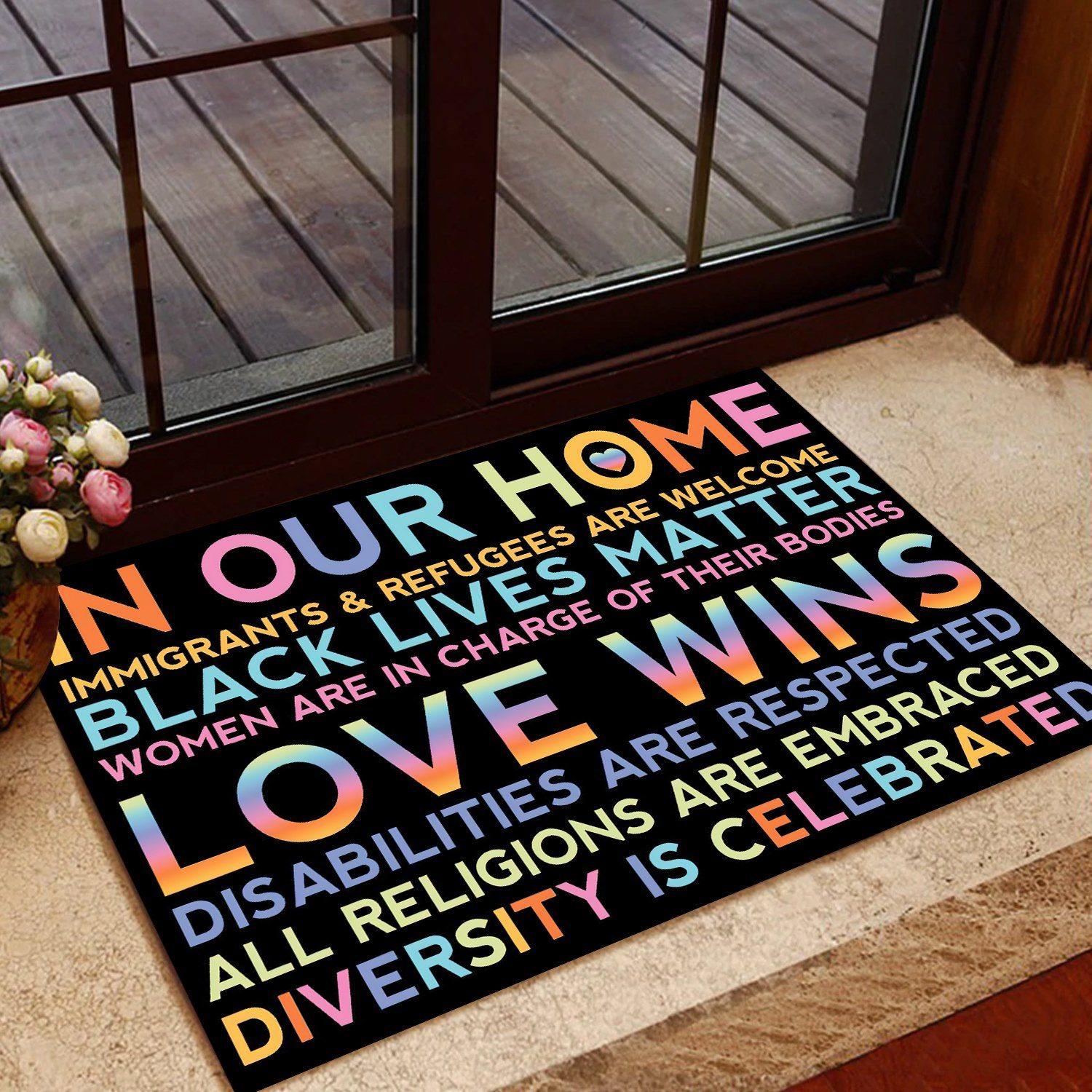 https://personal84.com/cdn/shop/products/lgbt-doormat-in-our-home-love-wins-gift-personal84-1_1500x.jpg?v=1640845896
